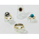 Four various 9ct yellow gold dress rings, comprising a garnet and cz-finger size Q, sapphire and