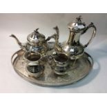 A four-piece EPNS tea and coffee service on oval galleried chair (5)