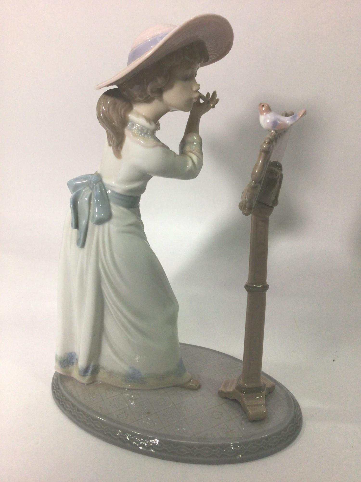 A Lladro porcelain figure of a lady playing the flute, 'Songbird No. 6093', signed to base, 24cm - Image 2 of 5