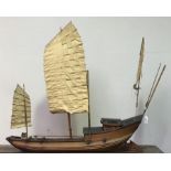 A late 19th/early 20th century Chinese bamboo and wooden Junk boat, with three masts and linen