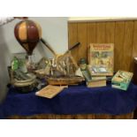 A mixed collection containing a squash and tennis racket, AA Book, Portsmouth Great War book,