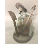 A Lladro porcelain figure of a lady playing a cello with music stand, 'Concerto No.6332', signed