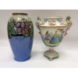 A Royal Doulton stoneware vase of ovoid form, decorated with fruiting grapevine to blue and olive