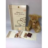 A Steiff collector's bear no. 037160, with press and listen music box playing 'Ode to Joy', golden