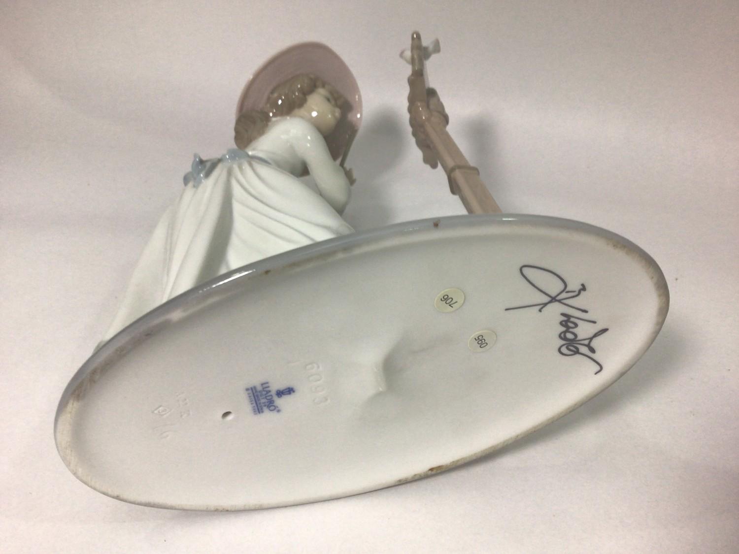 A Lladro porcelain figure of a lady playing the flute, 'Songbird No. 6093', signed to base, 24cm - Image 4 of 5