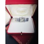 An 18ct white gold Cartier Tank Française watch, small model, quartz movement. Steel case set with