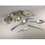 A small collection of assorted silver items comprising an import silver tea strainer by Samuel Boyce