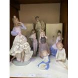 A Lladro porcelain figure '4763 The Obstetrician', together with six assorted NAO porcelain
