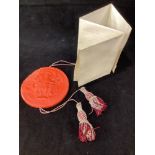 An Edward VII red wax seal, with cord running through centre, housed in circular copper skippet by