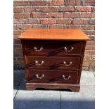 A 20th century small chest of drawers in mahogany with inlaid marquetry and brass drop handles