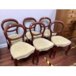 A set of six Victorian mahogany balloon back dining chairs with green velour upholstery