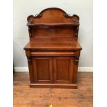 A Victorian mahogany chiffonier with small shaped shelf on back and shelved cupboard with twin doors