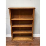 An early 20th century light oak open bookcase with 3 adjustable shelves measuring 87.5 wide, 126