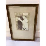 A signed three-quarter-length sepia photograph of Queen Marie of Romania (1875-1938) British