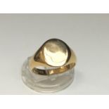 A gents solid 9ct yellow gold signet ring, weighs 10.3 grams.