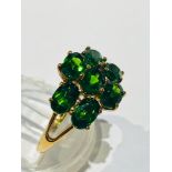 A 9ct gold Tourmaline dress ring, set with 7 x oval cut tourmalines in a claw setting, ring weighs