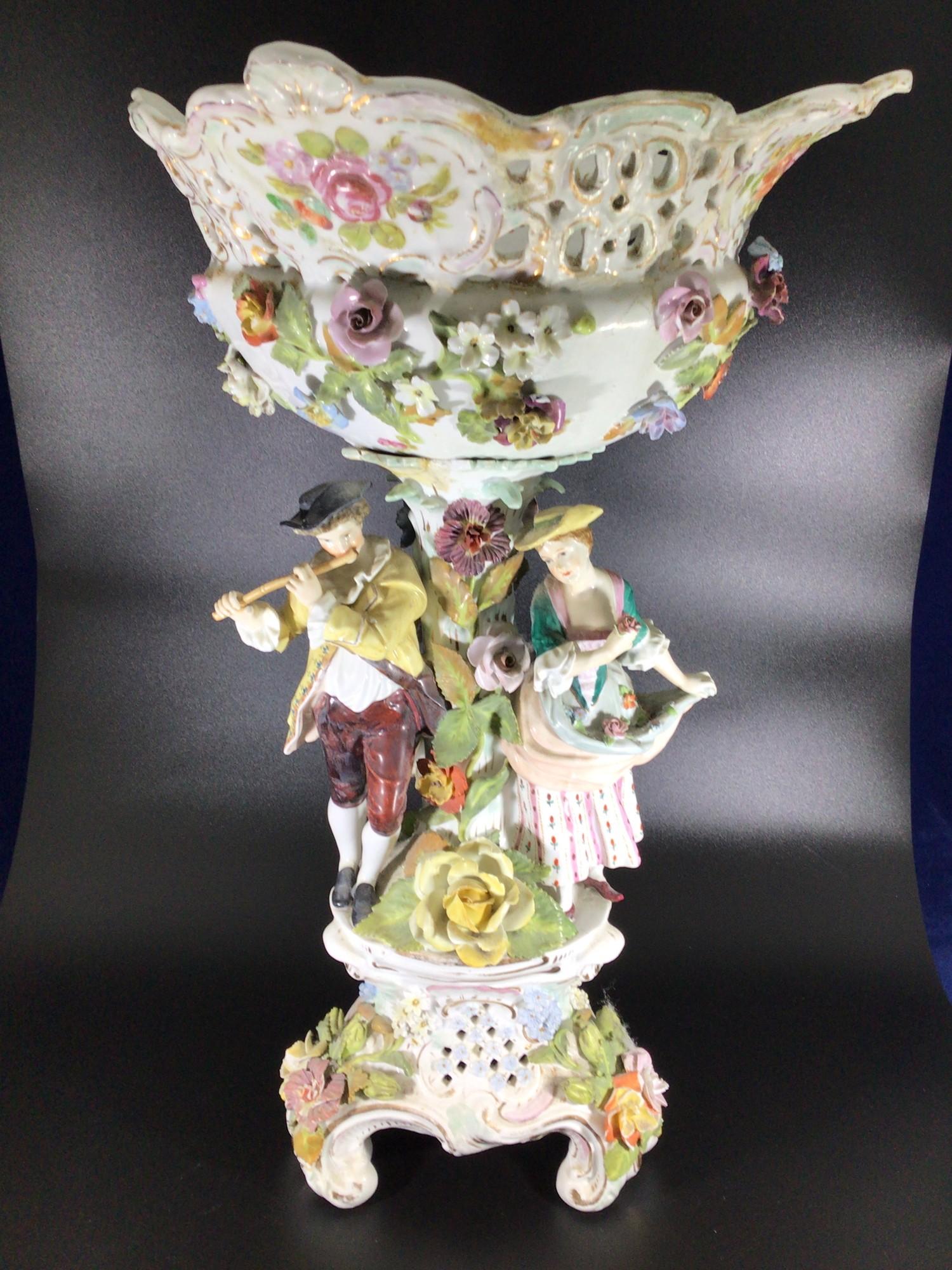 A late 19th / early 20th century large ceramic Dresden figural and floral encrusted comport,