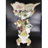 A late 19th / early 20th century large ceramic Dresden figural and floral encrusted comport,