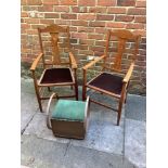 A pair of early 20th century oak carver dining chairs with tulip shaped splats. tapered legs and