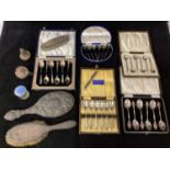 A small collection of assorted silver items comprising five cased sets of coffee and tea spoons