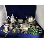 A quantity of silver-plated items including trays, toast rack, coffee set, condiment pots, cased set