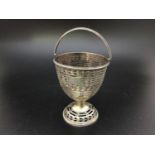A George III silver sugar basket by Hester Bateman, of vase form, with pierced sides and needed rim,