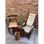 A 20th century mahogany American rocking chair with turned spindles and frame finished in a pale