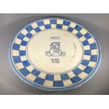 A Crown Ducal pottery royal commemorative charger by Charlotte Rhead, with blue and white