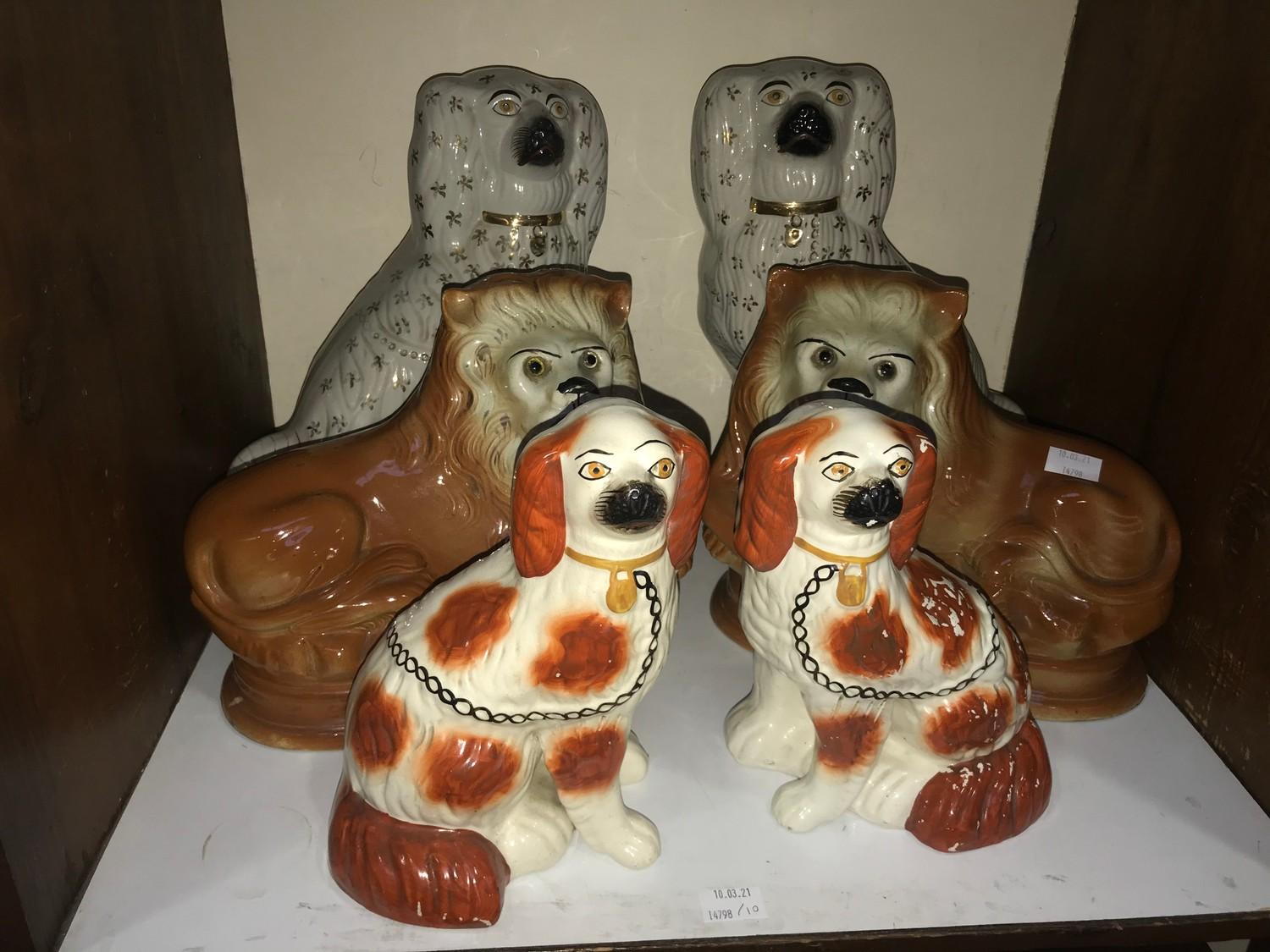 SECTION 10. Three various pairs of Staffordshire pottery figures including two pairs of Spaniels and