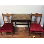 A pair of Edwardian low nursing chairs in the Sheraton 'style' together with a stained mahogany