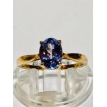 A 9ct yellow gold dress ring set with an oval cut tanzanite in a claw setting, the AA tanzanite