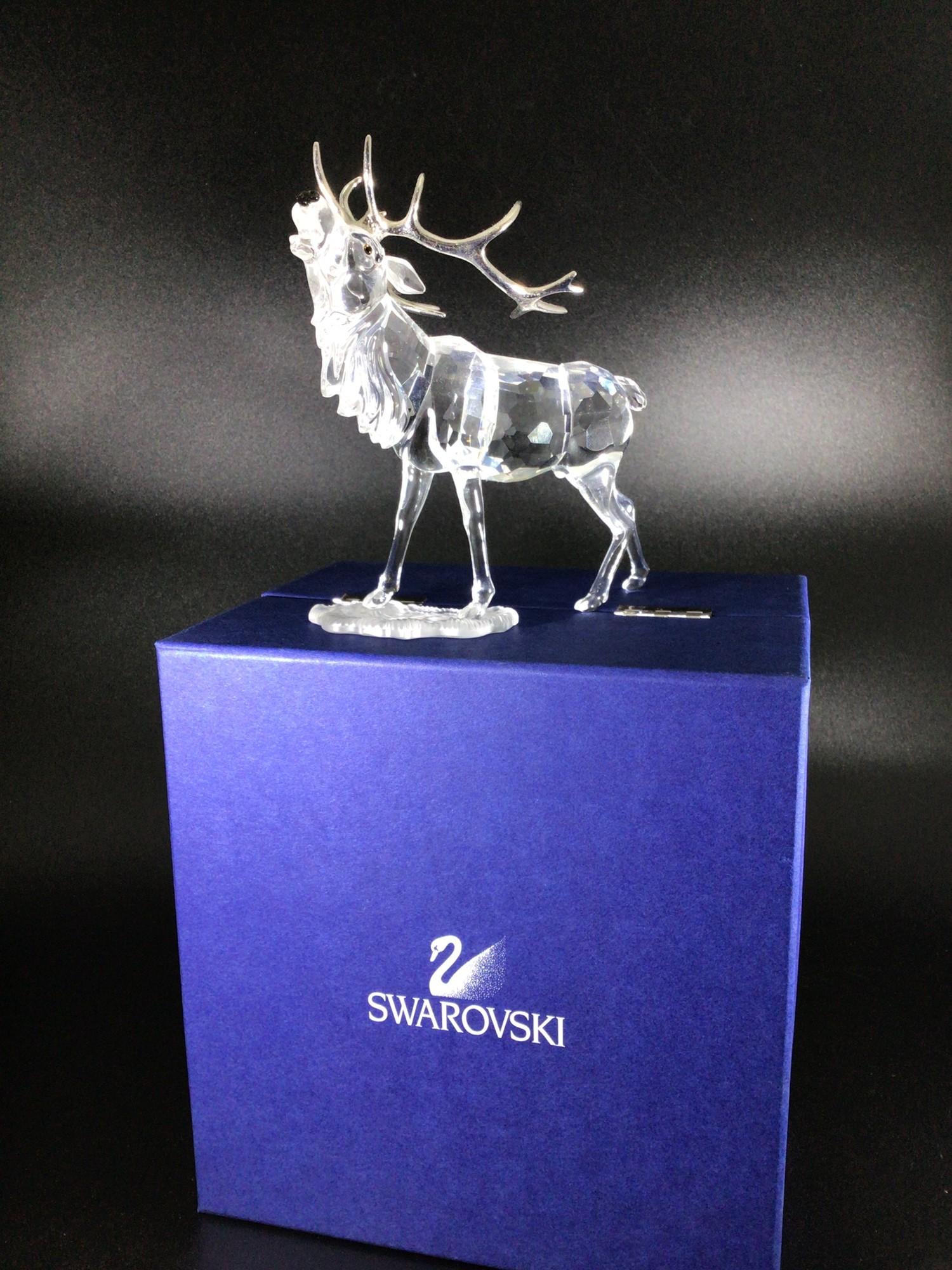 A Swarovski Crystal large figure of a Stag with silvered horns, designed by Adi Stocker, 14cm