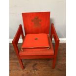 A Prince of Wales Investiture chair, red-stained beech frame with upholstered seat, gilt PoW motif