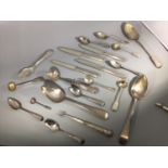 A small collection of assorted silver flatware, largely Georgian and Victorian examples comprising
