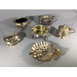 A small collection of assorted silver items comprising salts, spoons and a mustard with blue glass