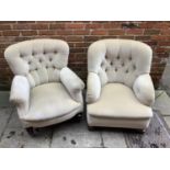 A pair of early 20th century button backed armchairs by Maple & co with mahogany turned legs and