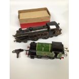 Two Hornby Meccano clockwork tinplate locomotives comprising a green Type 101 LNER 460 and a black