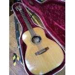 An acoustic guitar by Vince Hockey of Southampton, with cedar top, mother of pearl inlaid rosewood