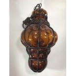 A Murano style mould blown amber glass and metal banded light fitting, approx. 45cm