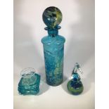 After Michael Harris, a Mdina glass bottle with globular stopper and a Mdina seahorse paperweight,