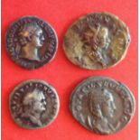 Four Roman coins, pictured from top left to right from the Emperor Domitian, Valerian 11,