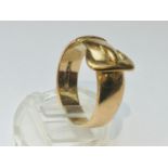 A gents 9ct gold buckle ring, weighs 7.3 grams, finger size V.