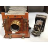 A 19th century mahogany cased plate camera with applied plaque 'By Royal Letters Patent', and a Ross