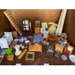 A collection of assorted dolls house furniture and accessories comprising a pair of armchairs, rugs,