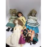 An assortment of dolls including bisque headed examples