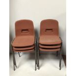 A set of eleven brown plastic stackable chairs by Remploy