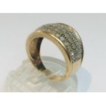 A 9ct yellow gold ring, set with small round brilliant cut diamonds set in a pave style, ring weighs