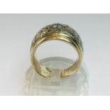 A 14ct yellow gold diamond ring set with one round brilliant cut diamond to the centre and 42 x