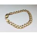A 9ct gold curb link bracelet, weighs 12.0 grams.