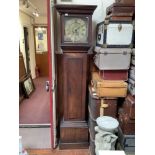 A longcase clock with brass dial, embossed spandrels and Roman numerals, date aperture, engraved